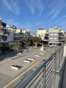 a view of a parking lot with some buildings at Central Square apartment by the sea in Ierápetra
