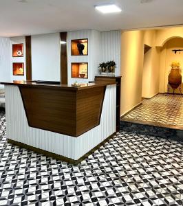 a lobby of a hotel with a counter at Guest Hotel in Istanbul