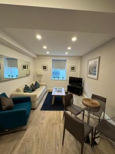 a living room with a couch and a table at Parnell Apartments in Dublin