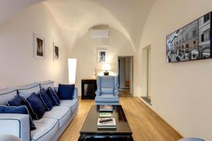 a living room with a couch and a table at B&B Dell'Olio in Florence