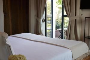 Postel nebo postele na pokoji v ubytování Relais Castello di Morcote
