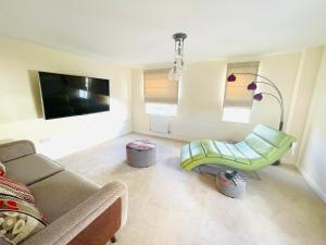 a living room with a couch and a chair at Cozy and comfy in Stanion +7 photos