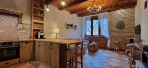 a kitchen with a wooden counter top in a room at Kasza Rusztika in Szekszárd