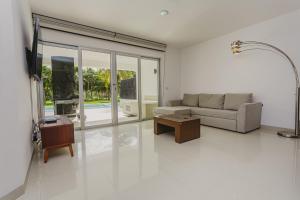 a living room with a couch and a table at Casa Mistica 703 N condo in Cedro