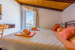 Postel nebo postele na pokoji v ubytování Apartmani Višnja