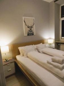 Posteľ alebo postele v izbe v ubytovaní Apartament Donnka