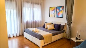 a bedroom with a bed with two candles on it at Sweet HOME GEMMA in Mestre +6 photos