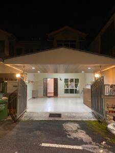 an empty garage at night with the lights on at Frosty Hills Homestay in Tanah Rata