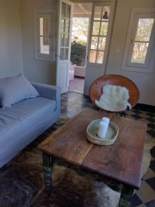 a living room with a couch and a coffee table at Casa La Cumbre in La Cumbre