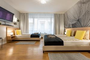 Postel nebo postele na pokoji v ubytování Budapest Holidays Apartments & Spa