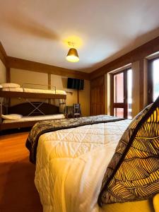 Letto o letti in una camera di Hotel Togo Monte Terminillo
