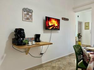 TV a/nebo společenská místnost v ubytování La Dimora di Anna e Ciccio