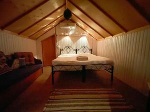 A bed or beds in a room at Live the bedouinlife