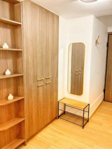 a room with a closet with a mirror and a shelf at Διαμέρισμα στην Καλλιθέα in Athens