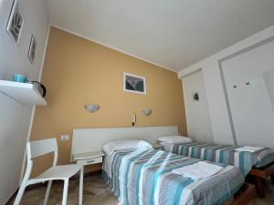 Voodi või voodid majutusasutuse Hotel Parini toas