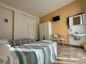 Voodi või voodid majutusasutuse Hotel Parini toas