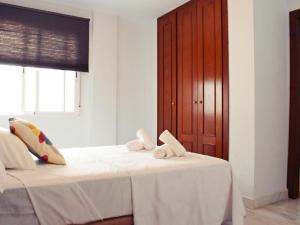 Posteľ alebo postele v izbe v ubytovaní Fabuloso apartamento junto al Soho con parking privado
