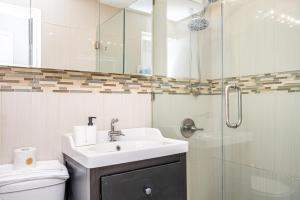 a bathroom with a sink and a shower at ATL Downtown 2BR King Bed Free Parking and Gym LM302 in Atlanta