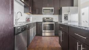 A kitchen or kitchenette at Landing Modern Apartment with Amazing Amenities (ID1180X314)