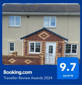 a house with a sign that reads travelling review awards at Hidden beauty in peaceful place in Peterlee +6 photos