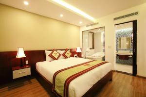 
Cama o camas de una habitación en Hoi An Travel Lodge Hotel
