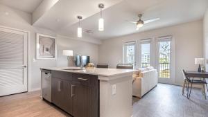 a kitchen with a sink and a counter top at Landing Modern Apartment with Amazing Amenities (ID8083X55) in Fort Myers Villas