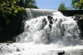 a waterfall with water coming out of it at Casa de colònies La Cadamont in Sant Joan les Fonts