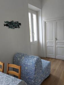 a living room with a couch and a window at Il mare in valigia in Imperia