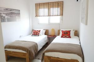 מיטה או מיטות בחדר ב-Large appartement with great views
