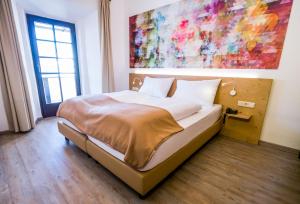 Postel nebo postele na pokoji v ubytování Family Hotel Schloss Rosenegg