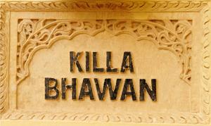a sign on the side of a building at Killa Bhawan in Jaisalmer