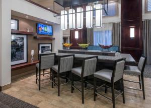 a dining room with a large table and chairs at Hampton Inn & Suites Jackson in Jackson