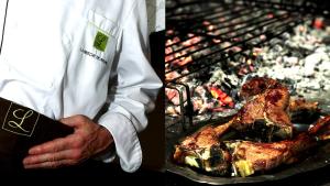 a man standing in front of a grill with meat at Logis Hôtel La Brèche de Roland in Gèdre