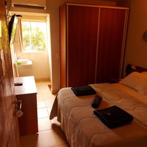 Postel nebo postele na pokoji v ubytování Madame Lynch Hotel Asuncion