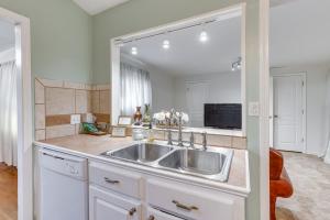 a kitchen with a sink and a large mirror at Pet-Friendly Birmingham Cottage with Private Hot Tub in Birmingham +23 photos