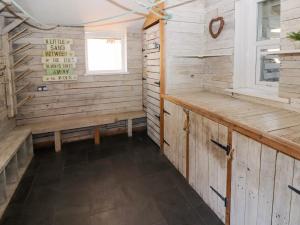 a sauna with wooden walls and a window at The Vines in Bridgend