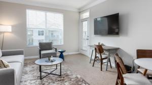 a living room with a couch and a table at Landing - Modern Apartment with Amazing Amenities (ID4410X01) in Lewis Center