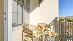 two chairs and a table on a balcony at Landing - Modern Apartment with Amazing Amenities (ID8201X11) in Orlando