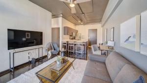 a living room with a couch and a tv at Landing - Modern Apartment with Amazing Amenities (ID7845X46) in Sparks