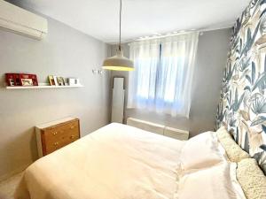 Posteľ alebo postele v izbe v ubytovaní Calu Homes Duplex cerca Playa de Huelin