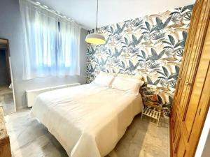 Posteľ alebo postele v izbe v ubytovaní Calu Homes Duplex cerca Playa de Huelin
