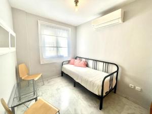 Posteľ alebo postele v izbe v ubytovaní Calu Homes Duplex cerca Playa de Huelin