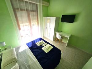 TV a/nebo společenská místnost v ubytování Mammasisi Rooms