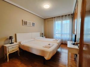 Posteľ alebo postele v izbe v ubytovaní Gestión de Alojamientos Apartments