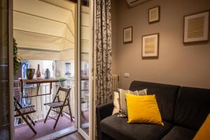a living room with a couch and a table at Smooth Mansion in Ponte Vecchio in Florence +45 photos