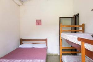 Ένα ή περισσότερα κρεβάτια σε δωμάτιο στο Piscina Vista Natureza Paz