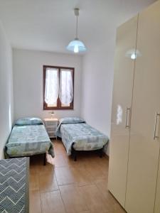 Ein Bett oder Betten in einem Zimmer der Unterkunft Casa di Lu