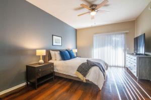 a bedroom with a bed and a ceiling fan at Landing - Modern Apartment with Amazing Amenities (ID1793X49) in Phoenix