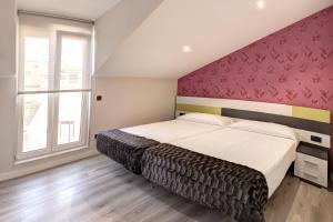 Postel nebo postele na pokoji v ubytování Apartamentos La Albarca