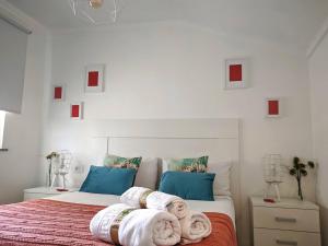 A bed or beds in a room at Ático 32